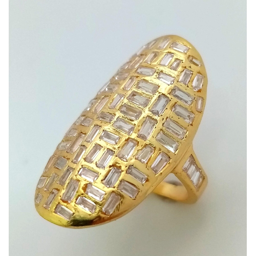 606 - A Handcrafted Shield-Like Gilded Sterling Silver and White Stone Ring. Size L/M. 6.89g total weight.