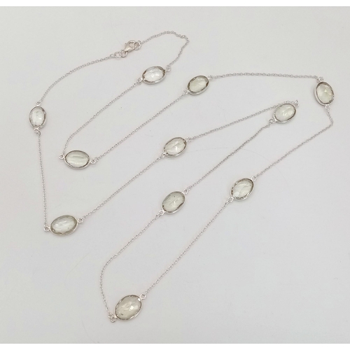 677 - A Green Amethyst Rope- Length Chain. Oval faceted amethysts set in 925 Sterling Silver. 48cwt.