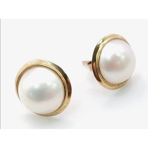 701 - A Pair of 9K Yellow Gold Cultured Pearl Cabochon Earrings. 
2.4g total weight. As new.