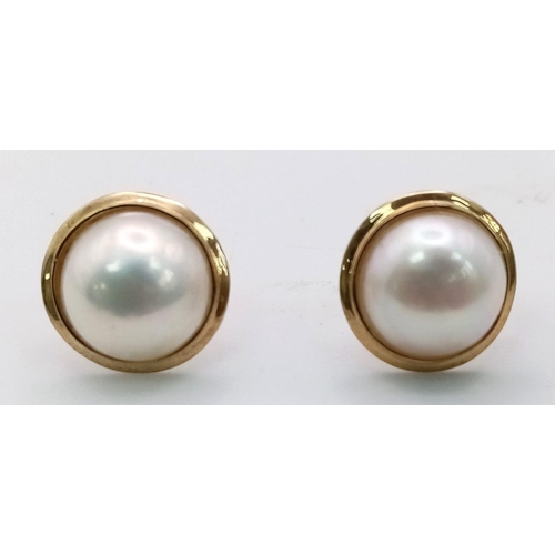 701 - A Pair of 9K Yellow Gold Cultured Pearl Cabochon Earrings. 
2.4g total weight. As new.