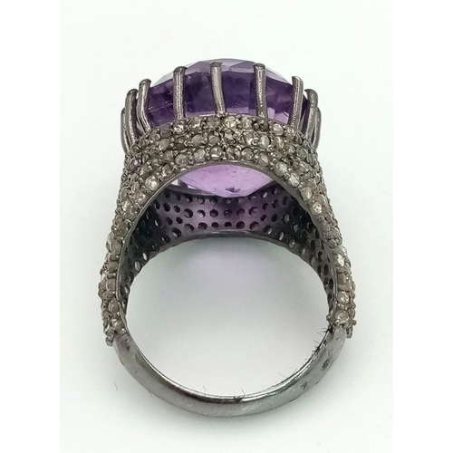 94 - An Electrifying 17ct Amethyst with 2.20ct of Diamond Accents Ring. A beautiful round cut amethyst wi... 