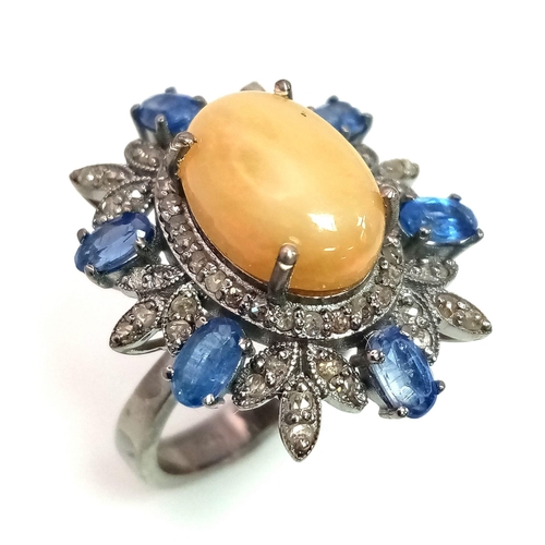 262 - A 3.75ct Opal Floral Explosion Ring with 2ct Kyanite and 0.80ct of Diamond Accents. Set in 925 silve... 