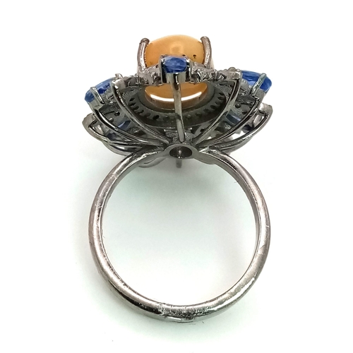 262 - A 3.75ct Opal Floral Explosion Ring with 2ct Kyanite and 0.80ct of Diamond Accents. Set in 925 silve... 