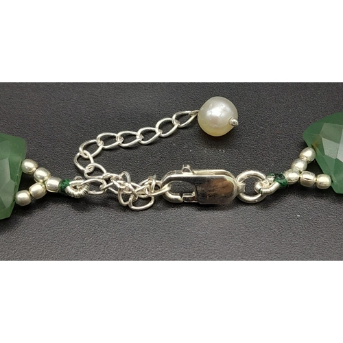 395 - A 430ct Graduated Green Chalcedony Choker Style Necklace with 925 Silver clasp. Rectangular cut. 26m... 