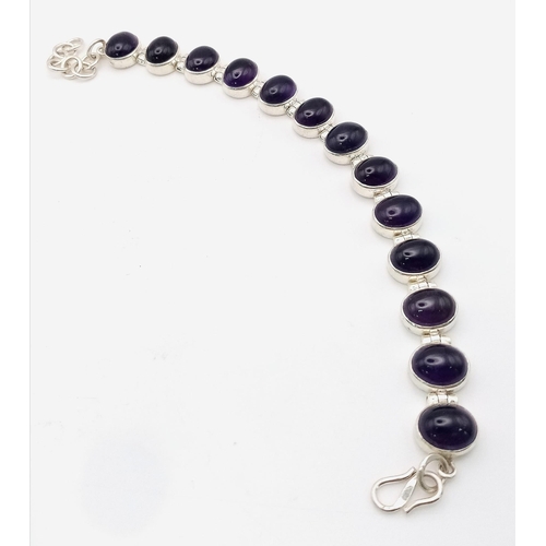 549 - A Brazilian Amethyst Tennis Bracelet. Oval cut amethysts set in 925 Sterling Silver. 66ctw. 28.7g to... 