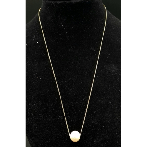 561 - A 9K Yellow Gold Disappearing Necklace with a Floating Round White Cultured Pearl. 44cm. 2.65g total... 