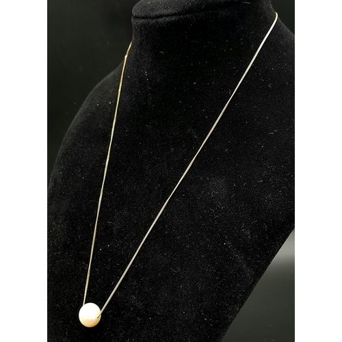 561 - A 9K Yellow Gold Disappearing Necklace with a Floating Round White Cultured Pearl. 44cm. 2.65g total... 