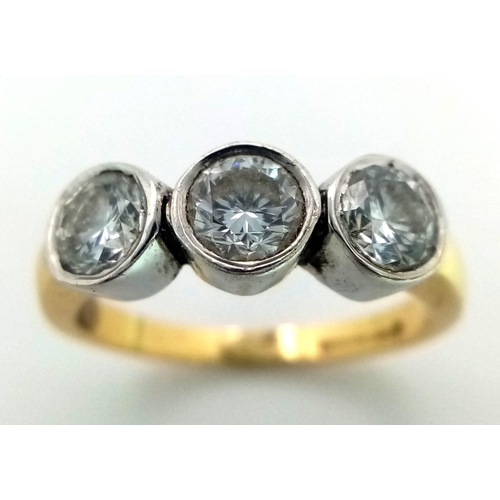 570 - An 18K Yellow Gold Diamond Trilogy Ring. Three brilliant round cut diamonds. 1.3ctw approx. Size M. ... 