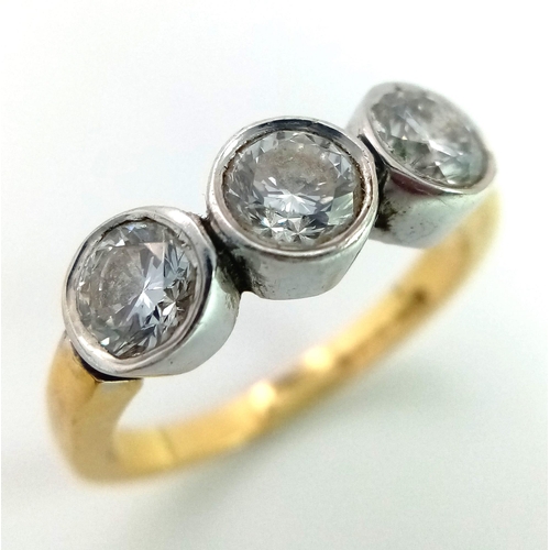 570 - An 18K Yellow Gold Diamond Trilogy Ring. Three brilliant round cut diamonds. 1.3ctw approx. Size M. ... 