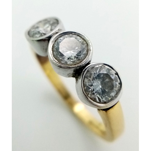 570 - An 18K Yellow Gold Diamond Trilogy Ring. Three brilliant round cut diamonds. 1.3ctw approx. Size M. ... 