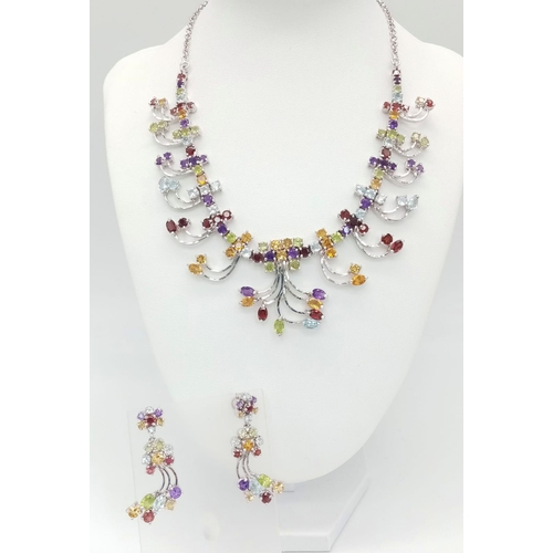 587 - A Multi-Colour Gemstone Necklace & Drop Earring Set. A kaleidoscope of rubies, citrine, topaz, ameth... 