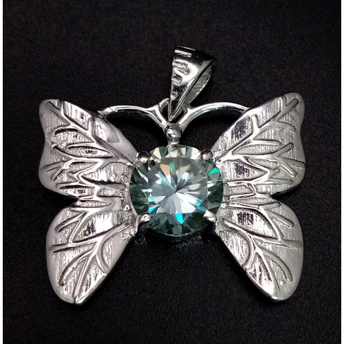 655 - A 2ct Blue Moissanite Butterfly Pendant set in 925 Silver. 25mm - comes with a GLI certificate.