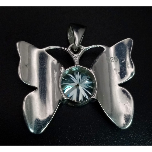 655 - A 2ct Blue Moissanite Butterfly Pendant set in 925 Silver. 25mm - comes with a GLI certificate.