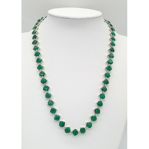 683 - An Emerald Gemstone Tennis necklace - Set in 925 Silver.
50 cushion cut emeralds. 35.27g total weigh... 