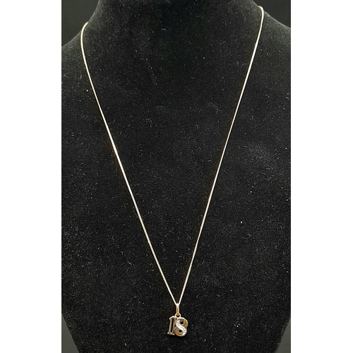 547 - A 9k Yellow Gold '18' Pendant on a 9K Yellow Gold Disappearing Necklace. Single small diamond on 8. ... 