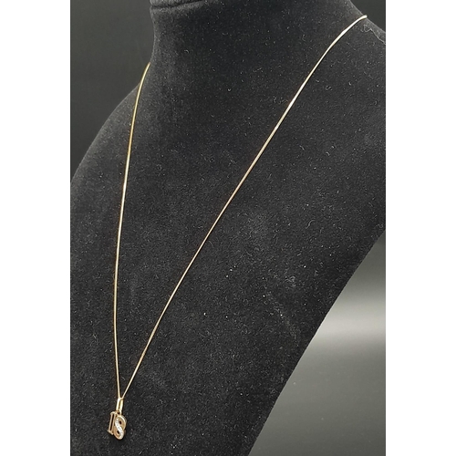 547 - A 9k Yellow Gold '18' Pendant on a 9K Yellow Gold Disappearing Necklace. Single small diamond on 8. ... 