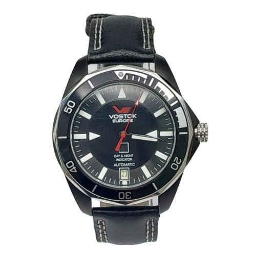 584 - A Vostok of Europe Automatic Gents Watch. Black leather strap. Two tone case with skeleton back - 41... 