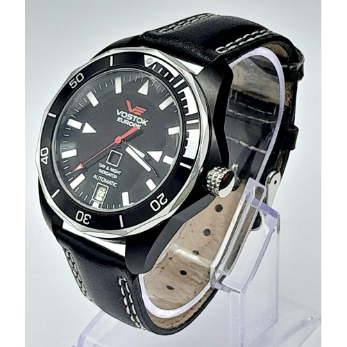 584 - A Vostok of Europe Automatic Gents Watch. Black leather strap. Two tone case with skeleton back - 41... 