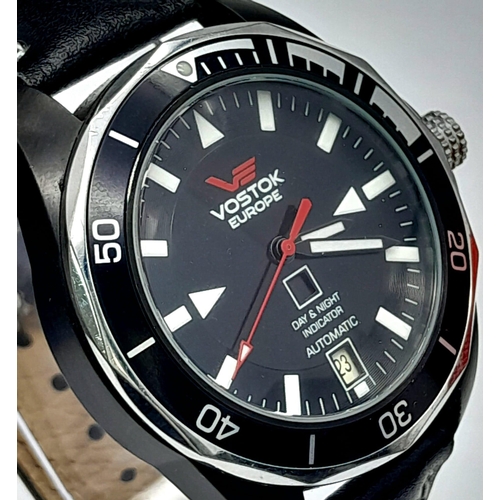 584 - A Vostok of Europe Automatic Gents Watch. Black leather strap. Two tone case with skeleton back - 41... 