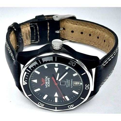 584 - A Vostok of Europe Automatic Gents Watch. Black leather strap. Two tone case with skeleton back - 41... 