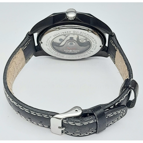 584 - A Vostok of Europe Automatic Gents Watch. Black leather strap. Two tone case with skeleton back - 41... 