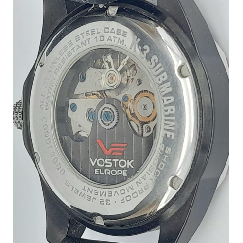 584 - A Vostok of Europe Automatic Gents Watch. Black leather strap. Two tone case with skeleton back - 41... 