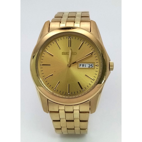 634 - A Vintage Seiko Gold Plated Quartz Gents Watch. GP strap and case -38mm. Gold tone dial with day/dat... 