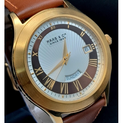 735 - A Hass and Cie Gents Quartz Watch. Brown leather strap. Two-tone case - 41mm. Two-tone dial with dat... 