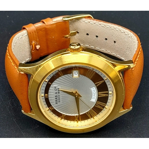 735 - A Hass and Cie Gents Quartz Watch. Brown leather strap. Two-tone case - 41mm. Two-tone dial with dat... 