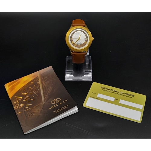 735 - A Hass and Cie Gents Quartz Watch. Brown leather strap. Two-tone case - 41mm. Two-tone dial with dat... 