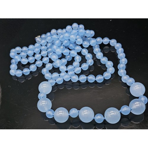 1020 - A Rope Length Graduated Blue Jade Bead Necklace. Perfect for different wearing arrangements. 142cm n... 