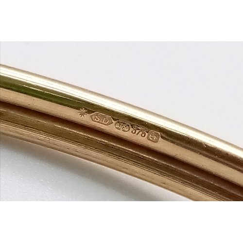 347 - A 9K GOLD BALL END BANGLE .   5.3gms