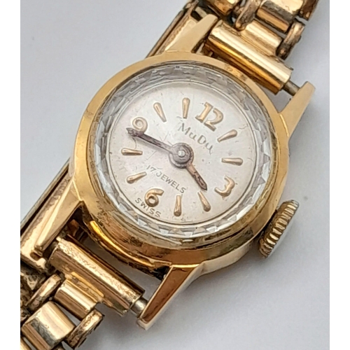 430 - A Vintage 18K Gold Cased Mudo Ladies Watch. Rolled gold bracelet. 18k gold case. Mechanical movement... 