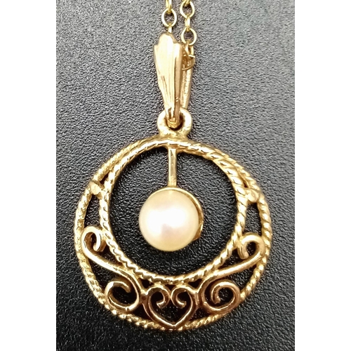 513 - A Vintage 9K Yellow Gold Pearl Pendant on a 9K Yellow Gold Disappearing Necklace. 25mm and 42cm. 1.9... 