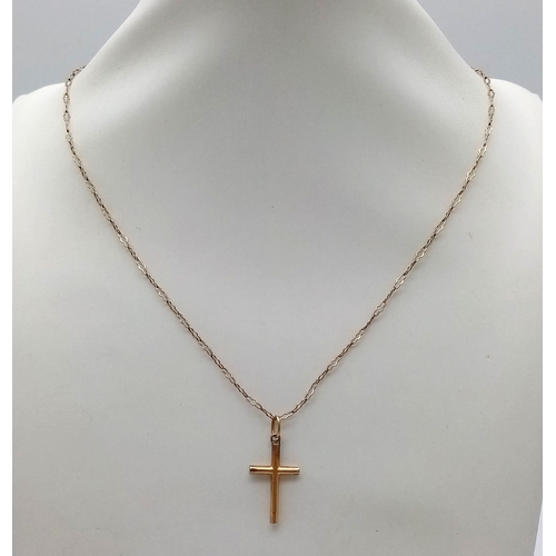 515 - A 9K Yellow Gold Cross Pendant on a 9K Yellow Gold Necklace. 25mm and 52cm. 2.26g total weight