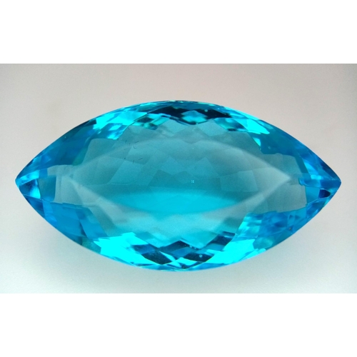 605 - A Large 61ct Lab Created Oval Cut Blue Topaz. Well faceted with, clean, with no marks or inclusions.... 