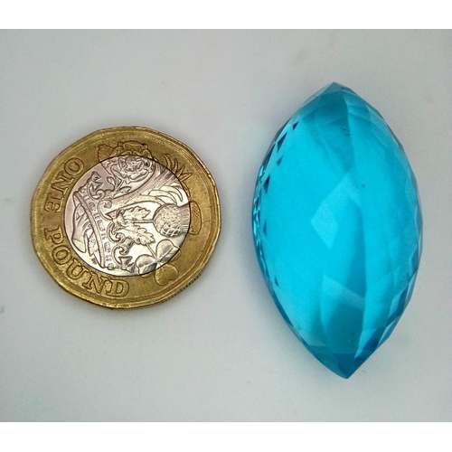 605 - A Large 61ct Lab Created Oval Cut Blue Topaz. Well faceted with, clean, with no marks or inclusions.... 