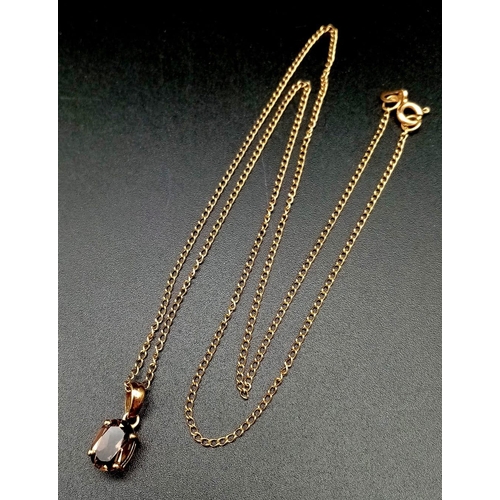 610 - A 9K Yellow Gold Smoky Quartz Pendant on a 9K Yellow Gold Necklace. 20mm and 44cm. 2.25g total weigh... 