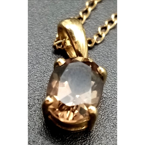 610 - A 9K Yellow Gold Smoky Quartz Pendant on a 9K Yellow Gold Necklace. 20mm and 44cm. 2.25g total weigh... 