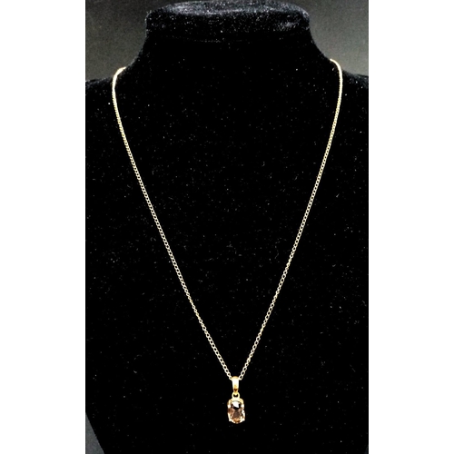 610 - A 9K Yellow Gold Smoky Quartz Pendant on a 9K Yellow Gold Necklace. 20mm and 44cm. 2.25g total weigh... 