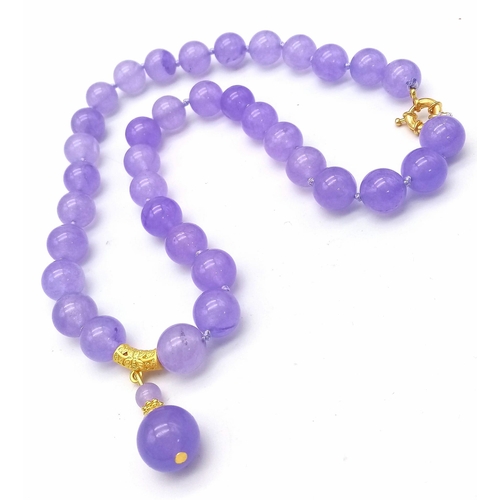 704 - A Lavender Jade Large Bead Necklace with Pendant Drop. 12mm jade beads with gilded accents and clasp... 