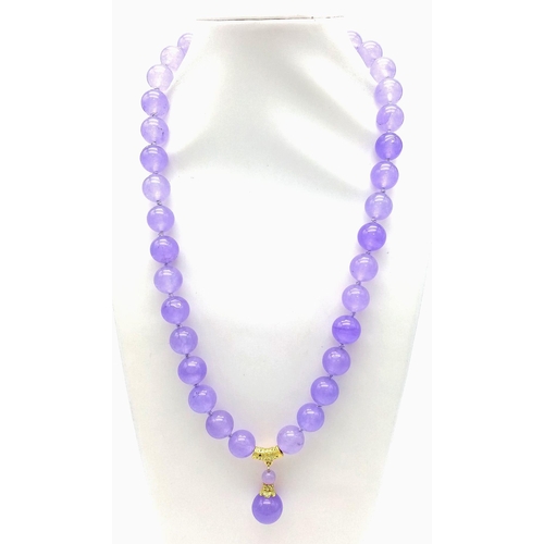 704 - A Lavender Jade Large Bead Necklace with Pendant Drop. 12mm jade beads with gilded accents and clasp... 