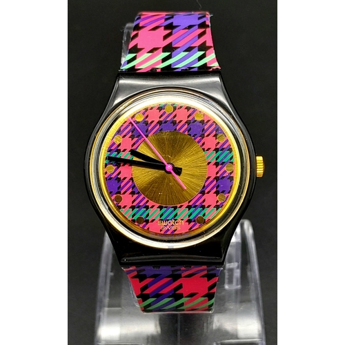 724 - A Vintage Swatch 'Tartan' Quartz Watch. In good condition and working order. Comes in original case.