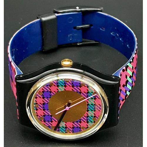 724 - A Vintage Swatch 'Tartan' Quartz Watch. In good condition and working order. Comes in original case.