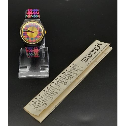 724 - A Vintage Swatch 'Tartan' Quartz Watch. In good condition and working order. Comes in original case.