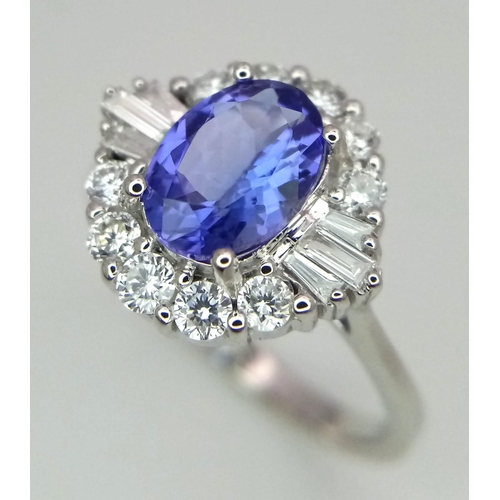 738 - An 18K white gold AA tanzanite and diamond ring. Oval tanzanite - 1.26ct. Round brilliant cut and ta... 