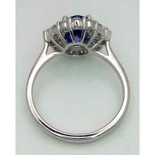 738 - An 18K white gold AA tanzanite and diamond ring. Oval tanzanite - 1.26ct. Round brilliant cut and ta... 