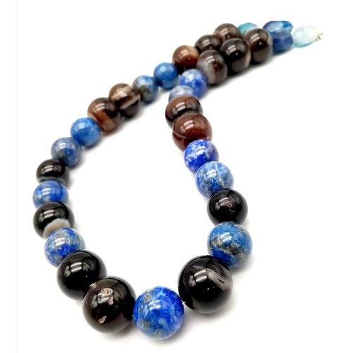 752 - A Large Bead Lapis Lazuli and Onyx Necklace. 15 and 20mm beads. 46cm necklace length.