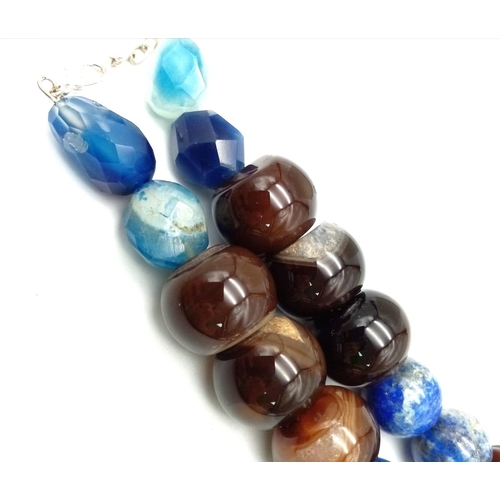 752 - A Large Bead Lapis Lazuli and Onyx Necklace. 15 and 20mm beads. 46cm necklace length.