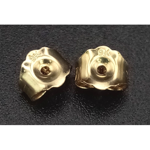 774 - A pair of 9K yellow gold cultured pearl droplet earrings with diamond halo bales. 0.15ct. Boxed. Ref... 